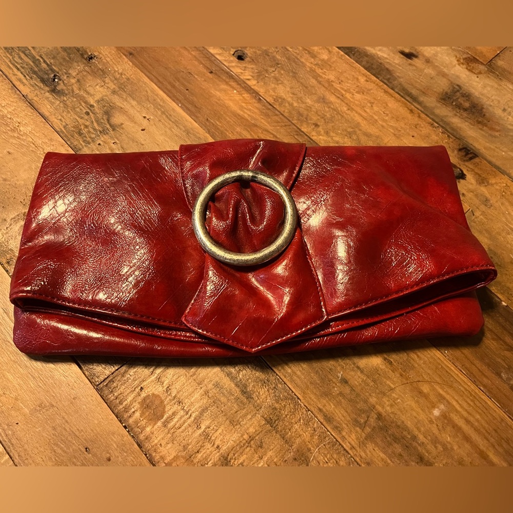 Red clutch purse fold over magnetic clasps. SHIRALEAH